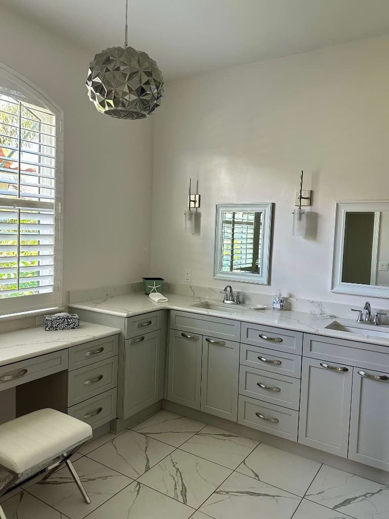 Spotless modern bathroom with marble countertops and polished fixtures